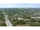 Aerial view of the area featuring a bridge, river, and community amenities at 2141 Cork Oak St, Sarasota, FL 34232