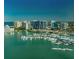 Expansive aerial view of a marina filled with boats, surrounded by buildings, and overlooking the city skyline at 2141 Cork Oak St, Sarasota, FL 34232