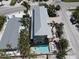 Stunning aerial view of the property showcasing the house, pool, spa and surrounding landscape at 220 36Th St, Holmes Beach, FL 34217