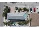 Bird's eye view of a stunning backyard pool, hot tub, and lush tropical landscaping at 220 36Th St, Holmes Beach, FL 34217