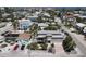 Aerial view of a two-story home with backyard pool and two car garage in a coastal neighborhood at 220 36Th St, Holmes Beach, FL 34217
