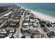 Aerial view of a residential area showcasing proximity to a white sandy beach and ocean at 220 36Th St, Holmes Beach, FL 34217
