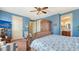 Comfortable bedroom with en-suite bathroom, coastal decor, and plenty of storage at 220 36Th St, Holmes Beach, FL 34217