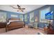 Spacious primary bedroom with ample natural light, coastal decor and en-suite bathroom at 220 36Th St, Holmes Beach, FL 34217
