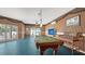 Spacious game room featuring a pool table, TV, and tropical-themed decor at 220 36Th St, Holmes Beach, FL 34217
