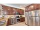 Well-equipped kitchen with stainless steel appliances, granite countertops, and ample cabinet space at 220 36Th St, Holmes Beach, FL 34217
