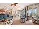 Cozy living room featuring a sectional sofa with access to a dining area and balcony at 220 36Th St, Holmes Beach, FL 34217