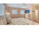 Well-lit primary bedroom with a bed featuring sea-themed bedding, a TV and beachy decor at 220 36Th St, Holmes Beach, FL 34217