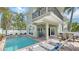 Back of house showing pool, with spa, lounge seating, and easy access from inside at 220 36Th St, Holmes Beach, FL 34217