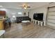 Open living room with bar stool seating and a view into the kitchen at 2307 29Th E Ave, Palmetto, FL 34221