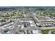 Aerial view of a condo community nestled amongst lush greenery and with a view of a golf course at 2507 Beneva Rd # 2, Sarasota, FL 34232