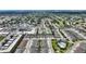 An aerial view of a neighborhood highlighting a community pool and townhomes with easy access to shops and community amenities at 2507 Beneva Rd # 2, Sarasota, FL 34232
