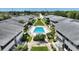 Community pool area featuring a swimming pool, lounge chairs, and landscaping for a relaxing outdoor space at 2507 Beneva Rd # 2, Sarasota, FL 34232