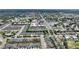An aerial view of a community with townhomes, a swimming pool, and access to a nearby golf course at 2507 Beneva Rd # 2, Sarasota, FL 34232