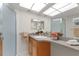 Bright bathroom with skylight, modern vanity, and updated fixtures at 2507 Beneva Rd # 2, Sarasota, FL 34232
