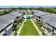 Aerial view of a condo complex with a green space and community pool at 2507 Beneva Rd # 2, Sarasota, FL 34232