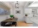 Dining area features an industrial style light fixture, a sign, and tile flooring at 2507 Beneva Rd # 2, Sarasota, FL 34232
