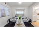 Stylish dining room showcasing table setting with an open view to the living spaces at 2507 Beneva Rd # 2, Sarasota, FL 34232
