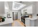This updated kitchen features stainless steel appliances, lots of counter space and a unique lighting fixture at 2507 Beneva Rd # 2, Sarasota, FL 34232