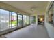 Spacious sunroom with views of the outdoors, creating a serene atmosphere at 2507 Beneva Rd # 2, Sarasota, FL 34232