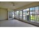 Enclosed lanai with abundant natural light and a view of the building exterior at 2507 Beneva Rd # 2, Sarasota, FL 34232