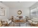 Bright and airy living room with seating and lots of natural light from the windows at 2507 Beneva Rd # 2, Sarasota, FL 34232