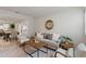 Cozy living room with neutral tones, wood accents, a decorative mirror, and lots of natural light at 2507 Beneva Rd # 2, Sarasota, FL 34232