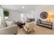 Open concept living room featuring a large decorative wall clock and dining area at 2507 Beneva Rd # 2, Sarasota, FL 34232