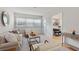 Living room with comfortable seating with views into dining room and kitchen at 2507 Beneva Rd # 2, Sarasota, FL 34232