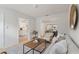 This cozy living room leads to the kitchen and dining room and is flooded with natural light at 2507 Beneva Rd # 2, Sarasota, FL 34232