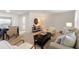 Spacious open-concept living area with dining set, couch and plentiful seating at 2507 Beneva Rd # 2, Sarasota, FL 34232