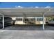 Shared covered parking structure in front of the complex offer an open parking spot for vehicles at 2507 Beneva Rd # 2, Sarasota, FL 34232