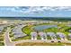 An aerial view of the community featuring lakes, landscaping, and nearby waterways at 251 Okeeffe Cir, Bradenton, FL 34212
