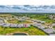 Overhead community view showing a scenic pond view and nicely landscaped backyards at 251 Okeeffe Cir, Bradenton, FL 34212