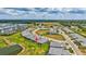 Community aerial showcases pond, lush landscaping, and well-maintained homes at 251 Okeeffe Cir, Bradenton, FL 34212