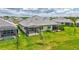 Home boasts a spacious backyard, screened lanai, and mature landscaping, creating a private outdoor oasis at 251 Okeeffe Cir, Bradenton, FL 34212