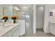 Modern bathroom featuring double vanity, quartz countertop, a glass enclosed shower, and tile flooring at 251 Okeeffe Cir, Bradenton, FL 34212