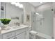 Modern bathroom featuring a glass-enclosed shower and vanity with a sleek quartz countertop at 251 Okeeffe Cir, Bradenton, FL 34212