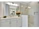 Contemporary bathroom with a glass-enclosed shower, vanity, and a well-lit mirror, offering a fresh design at 251 Okeeffe Cir, Bradenton, FL 34212