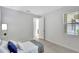 Bright bedroom with tile floors, neutral walls and a window letting in plenty of natural light at 251 Okeeffe Cir, Bradenton, FL 34212