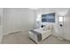 Stylish bedroom with tile flooring, soft daybed, soft lighting, and artwork at 251 Okeeffe Cir, Bradenton, FL 34212