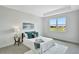 Bright bedroom with a large window offering a view of the community, neutral tones, and tile flooring at 251 Okeeffe Cir, Bradenton, FL 34212