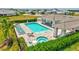 Community pool with spa, lounge chairs, and covered seating, creating a resort-style living experience at 251 Okeeffe Cir, Bradenton, FL 34212