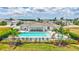 View of the community pool, cabana, and seating, perfect for relaxation and socializing at 251 Okeeffe Cir, Bradenton, FL 34212
