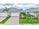 Well maintained home with paver driveway, attached 2 car garage, and landscaped front yard at 251 Okeeffe Cir, Bradenton, FL 34212
