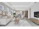 Stylish living room with modern decor and an open layout connecting to the kitchen and dining areas at 251 Okeeffe Cir, Bradenton, FL 34212