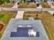 Birds-eye view of a home with solar panels on the roof, and beautiful roof shingles at 2759 Starview Ave, North Port, FL 34288