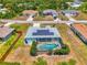 Charming single-story home with a screened pool, solar panels, and well-manicured landscaping at 2759 Starview Ave, North Port, FL 34288