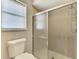 Bathroom featuring a tiled shower and frosted glass door at 2759 Starview Ave, North Port, FL 34288