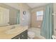 Inviting bathroom featuring a shower/tub combo with a shower curtain at 2759 Starview Ave, North Port, FL 34288